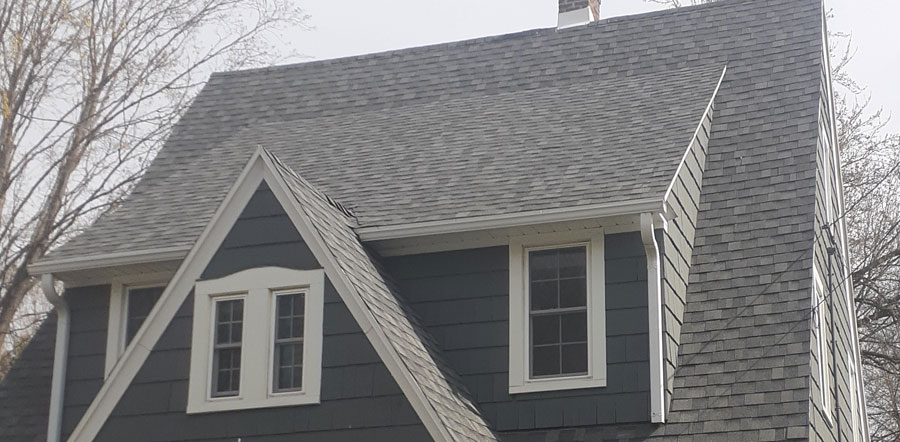 A new gray roof on a blue/gray home