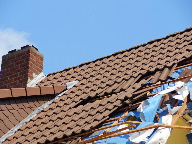 A roof that has a hole in it - avoid scams and hire a reputable roofing contractor
